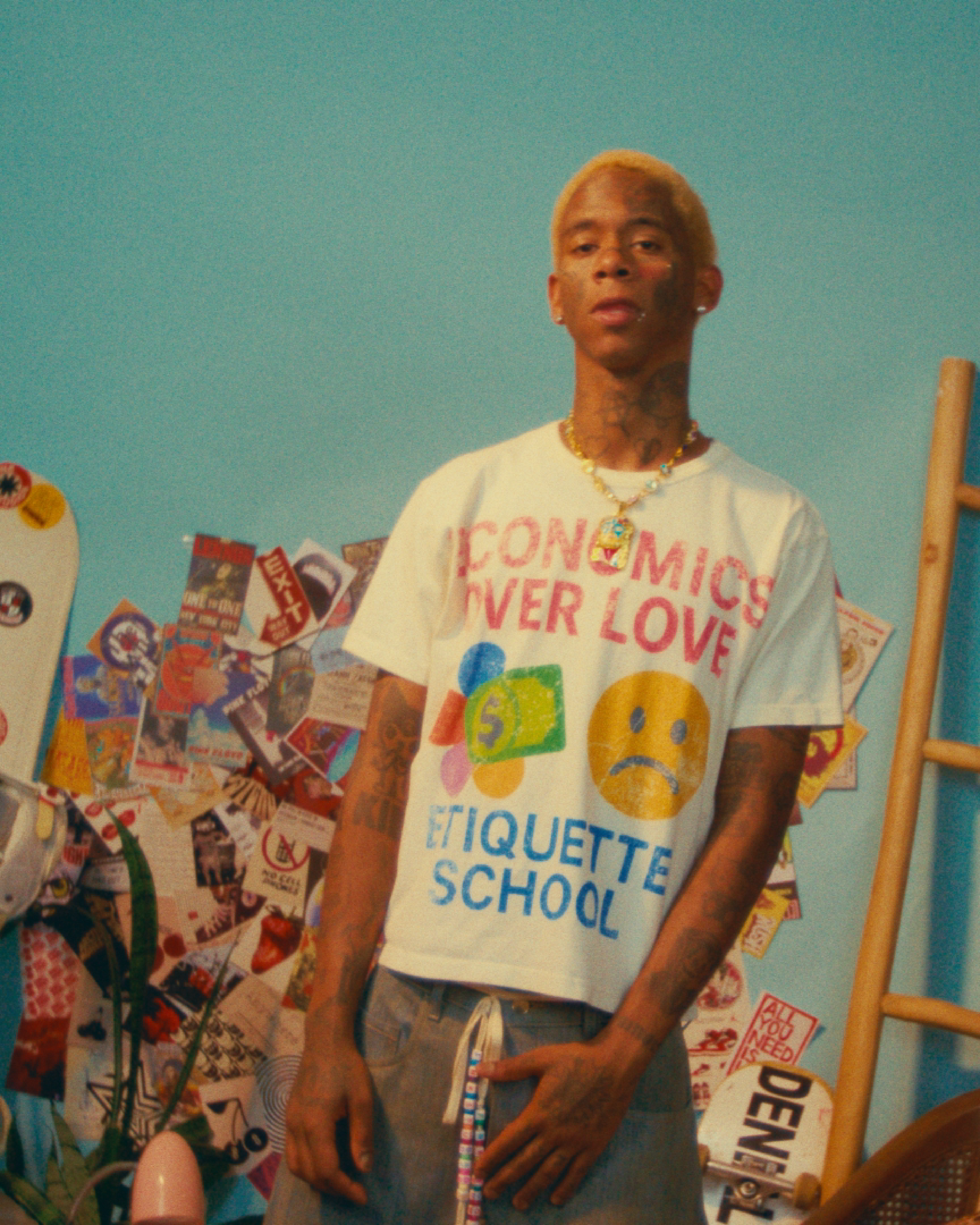 Model wearing an FNK Studios graphic T-shirt and jewelry for the SS26 campaign