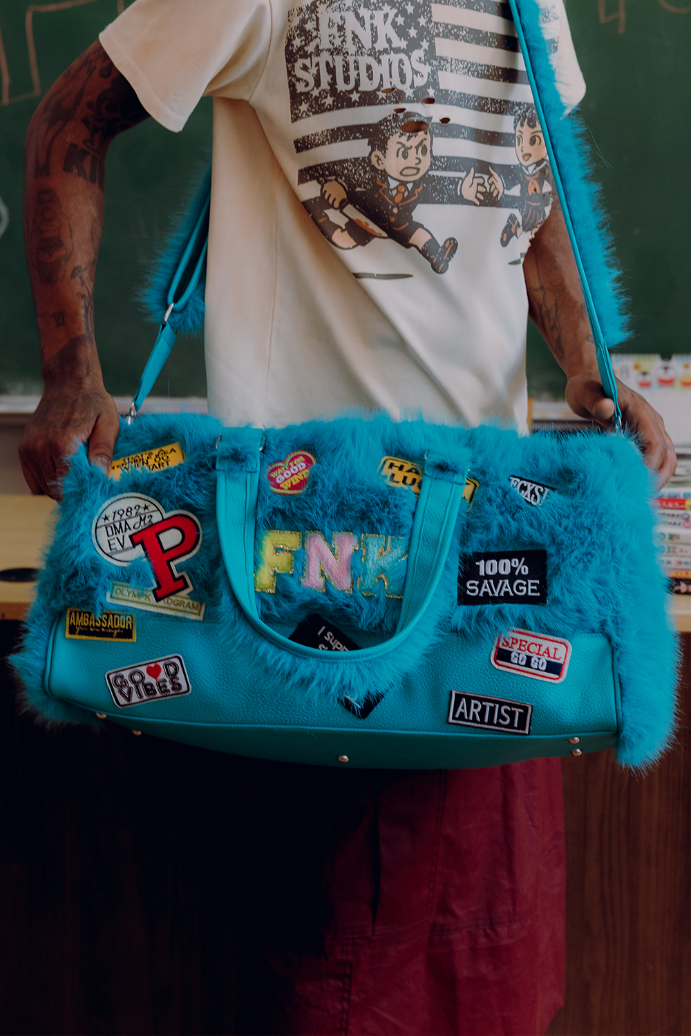 Big Leagues blue faux-fur duffle bag – styled on model
