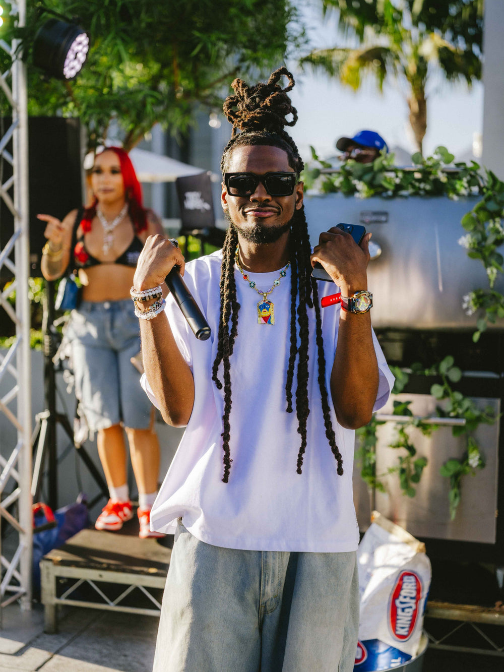 @thatsdjblue wearing Lucky Charm Mona Lisa Jesus Chain