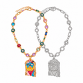 Lucky Charm and Glacier Berry complete chains overlapping on white, both pendants fully visible